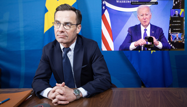 Prime Minister Ulf Kristersson with President Joe Biden on screen at a digital meeting