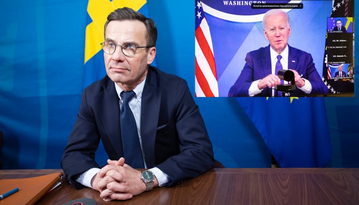 Prime Minister Ulf Kristersson with President Joe Biden on screen at a digital meeting