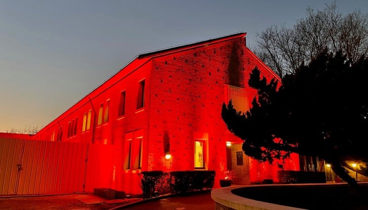 Main building at Embassy of Sweden in orange light